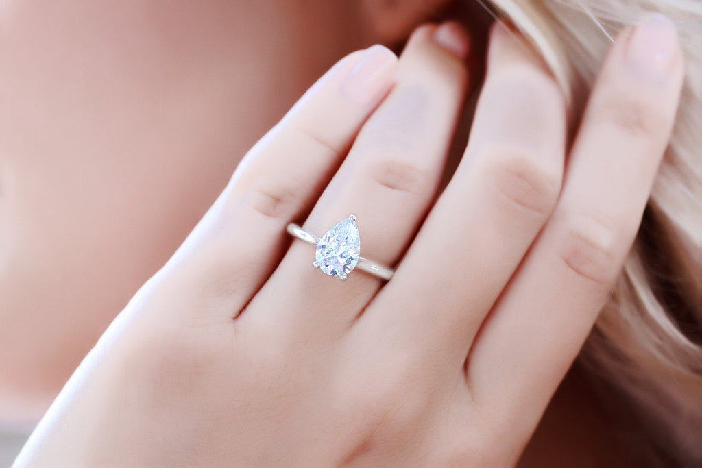 2 carat pear shaped diamond ring on hand Clearance